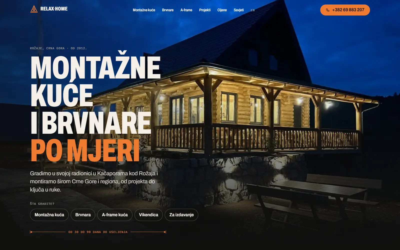 The new Relax Home site: the headline Prefabricated houses and log cabins made to measure over a photo of a lit log cabin, with a menu by building type